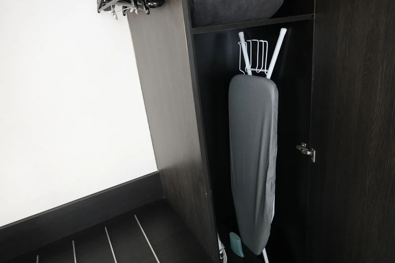 Ironing board stored inside our room wardrobe at The Benson Hotel