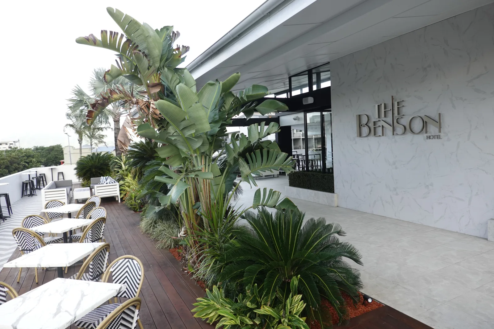 Outdoor terrace beside the entrance to The Benson Hotel Cairns